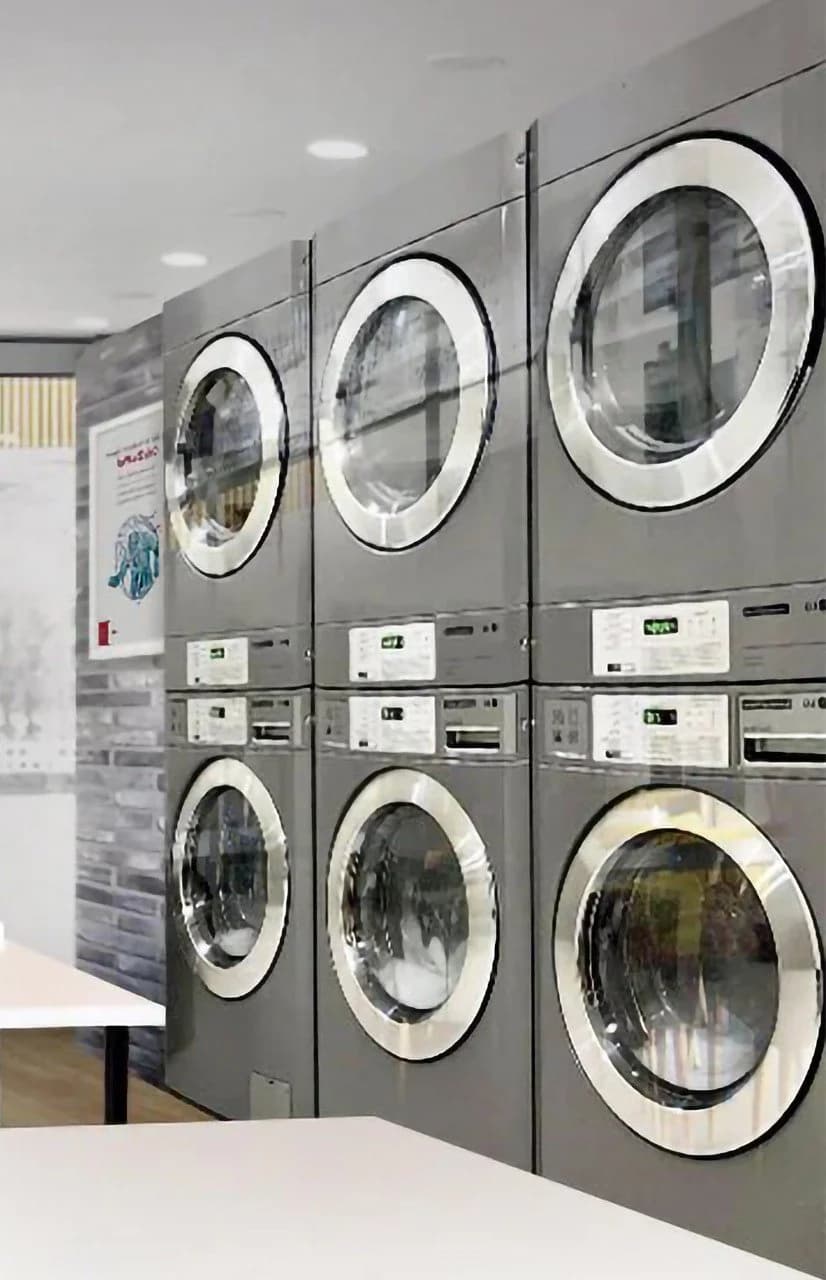 Bank of commercial washing and drying machines